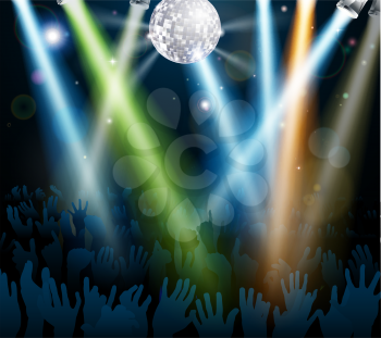 Crowd dancing at a concert or on a disco nightclub dance floor with hands up under a mirror ball with lights
