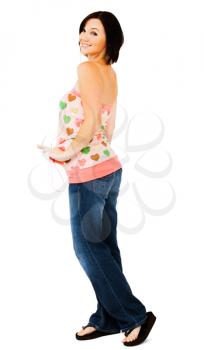Royalty Free Photo of a Woman Looking over her Shoulder and Posing for the Camera