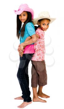 Royalty Free Photo of Two Sisters Back to Back Embracing Each Other