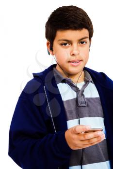 Royalty Free Photo of a Young Boy Listening to Music on Earbuds