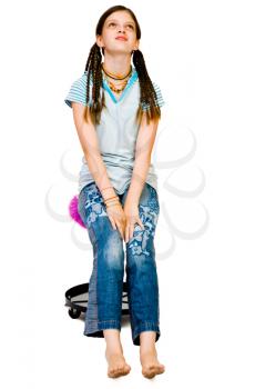 Royalty Free Photo of a Young Female Fashion Model Sitting on a Stool
