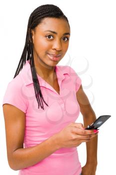 Royalty Free Photo of a Teenage Girl Text Messaging on her Phone