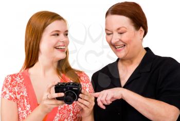 Caucasian women holding a camera and smiling isolated over white