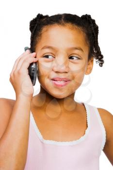 Girl talking on a mobile phone isolated over white