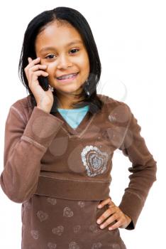 Girl using a cell phone isolated over white