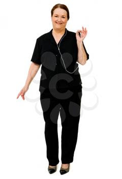 Caucasian woman listening to music on MP3 player isolated over white