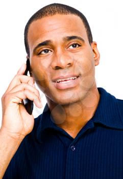 African American man talking on a mobile phone isolated over white