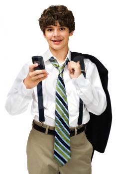 Confident boy text messaging on a mobile phone isolated over white