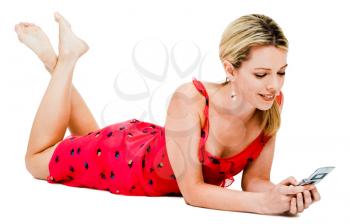 Happy woman text messaging on a mobile phone isolated over white