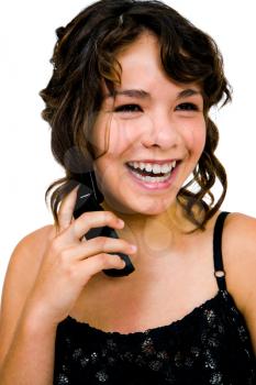 Close-up of a teenage girl talking on a mobile phone isolated over white