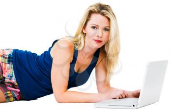 Portrait of a mid adult woman using a laptop isolated over white