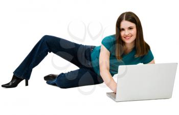 Caucasian woman using a laptop and smiling isolated over white