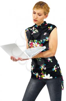 Caucasian young woman using a laptop isolated over white