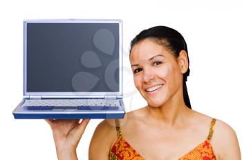 Happy young woman holding a laptop isolated over white