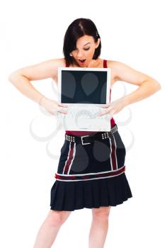Woman holding a laptop isolated over white
