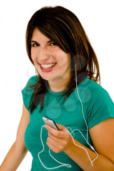 Woman listening to music on a MP3 player and smiling isolated over white