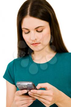Caucasian woman text messaging on a mobile phone isolated over white
