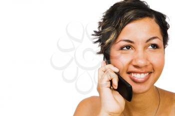 Mixed race woman talking on a mobile phone isolated over white