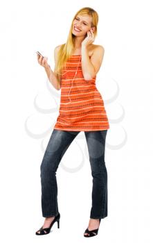 Young woman listening to music on MP3 player isolated over white