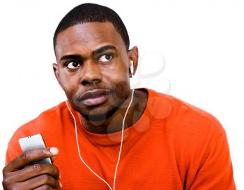 French man listening to music on a MP3 player isolated over white