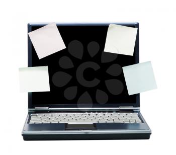 Adhesive notes on a laptop isolated over white