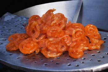 Jalebis (An Indian traditional sweet food) at a market stall, Delhi, India