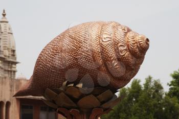Detail of conch shell sculpture at a temple, Chhatarpur Temple, New Delhi, India