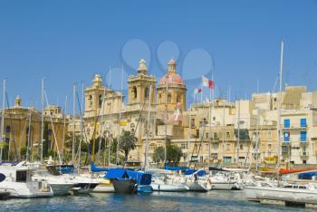 Boats with a church in the background, San Lawrenz Church, Grand Harbor, Birgu, Malta