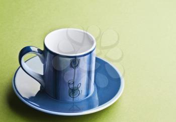 Close-up of a saucer with a tea cup