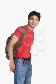 Man carrying a bag and smiling