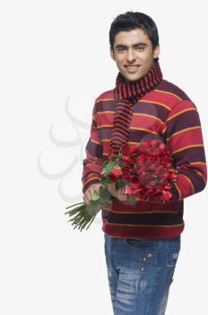 Man holding a bouquet of flowers