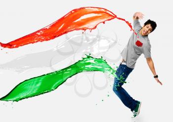 Tricolor paints being splashed on a man