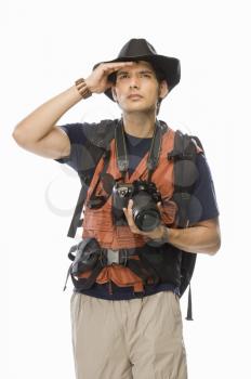 Young male photographer holding a digital camera