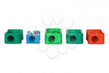 Assorted colorful pencil sharpeners in a row