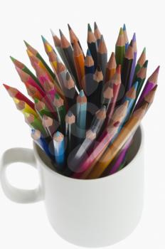 Close-up of colored pencils in a desk organizer
