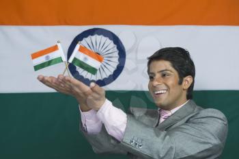 Close-up of a man holding Indian flags