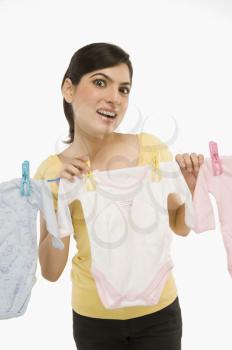 Woman hanging clothes on a clothesline