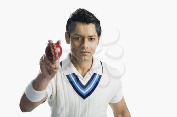 Portrait of a cricket bowler holding a ball