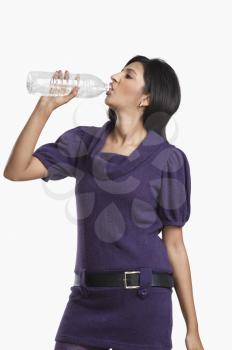 Woman drinking water with a bottle
