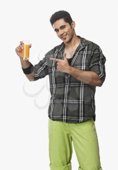 Man pointing at a glass of juice