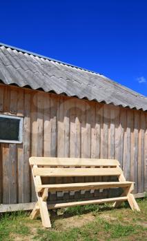 wooden bench near wooden wall