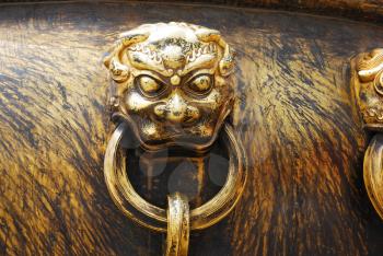 Ancient bronze lions as a handle of vat in Forbidden City