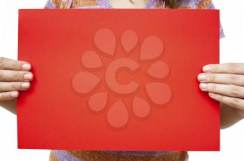 Royalty Free Photo of a Woman Holding a Sheet of Red Paper