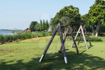 The recreation swing in the public park. Photo in Suzhou, China.