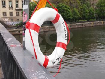 A life buoy of Berliner Feuerwehr meaning Berlin Fire Department on river Sprea in Berlin