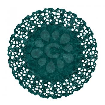 green decorated ornamental paper doily over white