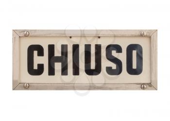 Chiuso (translation: Closed) sign a in shop window isolated over white background