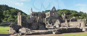 Wide panoramic view of Tintern Abbey (Abaty Tyndyrn in Welsh) ruins in Tintern, UK (high resolution)