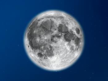 Full moon seen with an astronomical telescope over blue sky with stars
