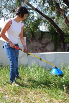 Royalty Free Photo of a Woman Fertilizing Soil